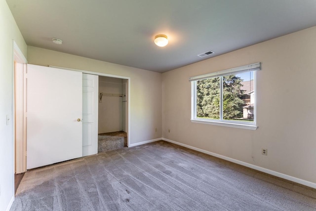 956 Rockefeller Ln, Madison, WI 53704 - unfurnished bedroom featuring carpet floors, baseboards, and a closet