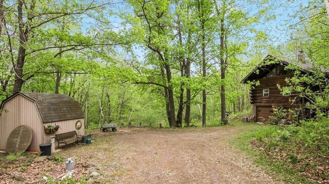 W16056 Camp Rd, Weyerhaeuser, WI 54895 - view of yard featuring central AC