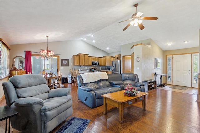 605 E Rime St, Orfordville, WI 53576 - living room with a chandelier, vaulted ceiling, wood finished floors, and a ceiling fan