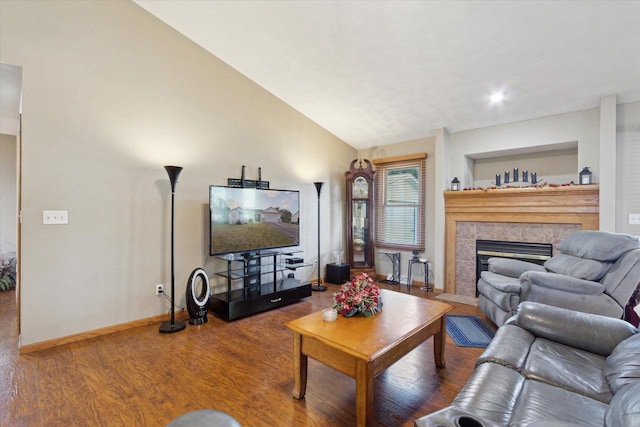 605 E Rime St, Orfordville, WI 53576 - living room with wood finished floors, a tiled fireplace, baseboards, vaulted ceiling, and recessed lighting