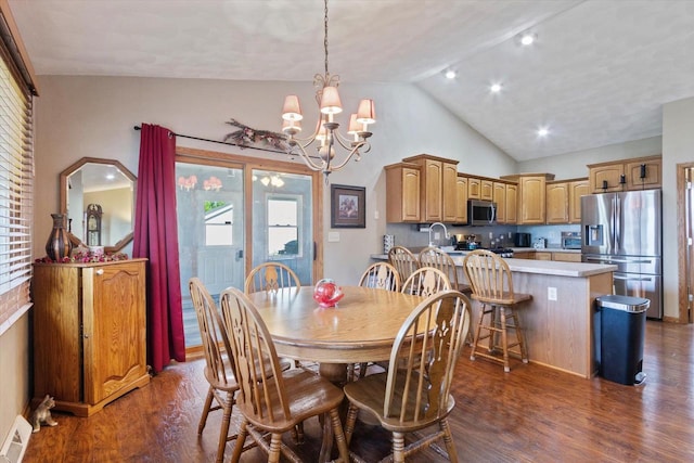 605 E Rime St, Orfordville, WI 53576 - dining area with dark wood finished floors, plenty of natural light, a chandelier, and high vaulted ceiling
