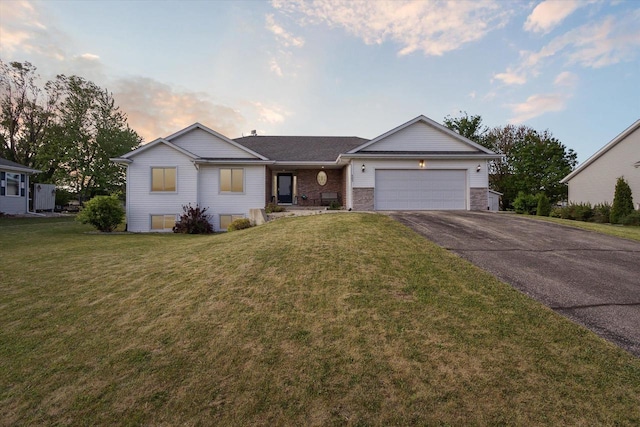 605 E Rime St, Orfordville, WI 53576 - ranch-style home featuring an attached garage, driveway, and a front yard