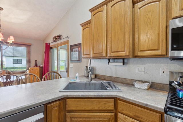 605 E Rime St, Orfordville, WI 53576 - kitchen featuring a sink, stainless steel microwave, a chandelier, lofted ceiling, and dishwasher