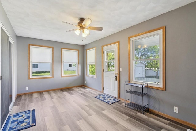 605 E Rime St, Orfordville, WI 53576 - foyer with healthy amount of natural light, baseboards, and a ceiling fan