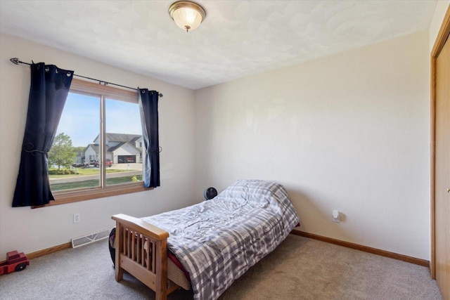 605 E Rime St, Orfordville, WI 53576 - carpeted bedroom featuring baseboards