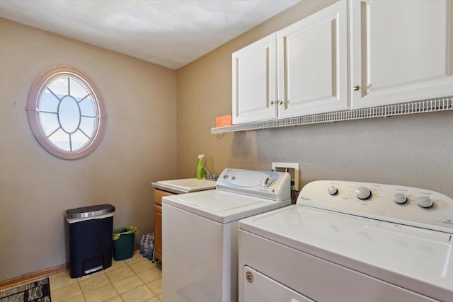 605 E Rime St, Orfordville, WI 53576 - laundry area featuring washing machine and clothes dryer, cabinet space, and light tile patterned floors