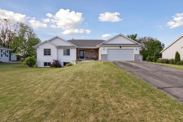 605 E Rime St, Orfordville, WI 53576 - ranch-style house with asphalt driveway, an attached garage, and a front yard
