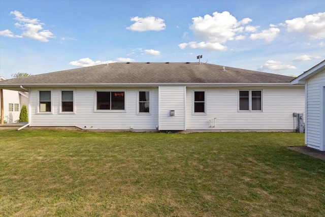 605 E Rime St, Orfordville, WI 53576 - rear view of house with a lawn and roof with shingles