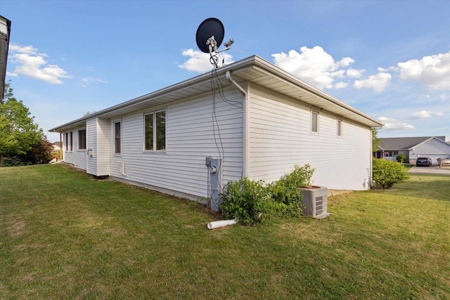 605 E Rime St, Orfordville, WI 53576 - view of side of home featuring a yard and ac unit