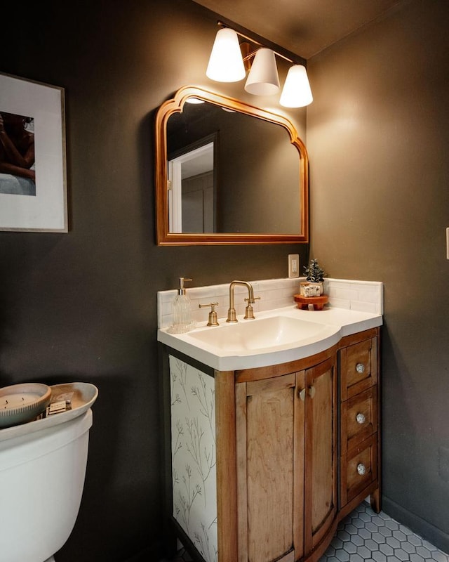 6935 N Yates Rd, Fox Point, WI 53217 - bathroom with vanity, toilet, and tile patterned flooring