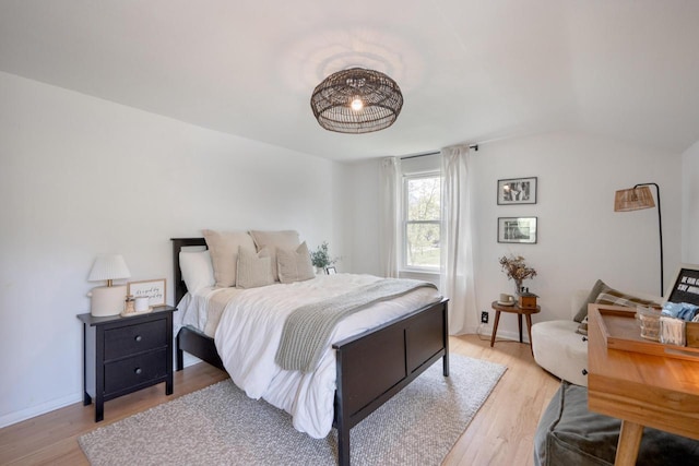 6935 N Yates Rd, Fox Point, WI 53217 - bedroom with light wood finished floors and lofted ceiling