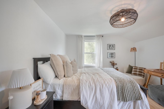 6935 N Yates Rd, Fox Point, WI 53217 - bedroom with lofted ceiling and wood finished floors