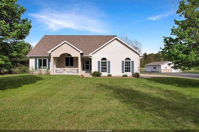 N2242 Keller Rd, Marinette, WI 54143 - ranch-style house with covered porch, a front yard, and roof with shingles