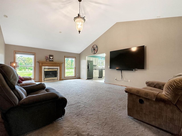 N2242 Keller Rd, Marinette, WI 54143 - carpeted living area featuring high vaulted ceiling, plenty of natural light, and a glass covered fireplace