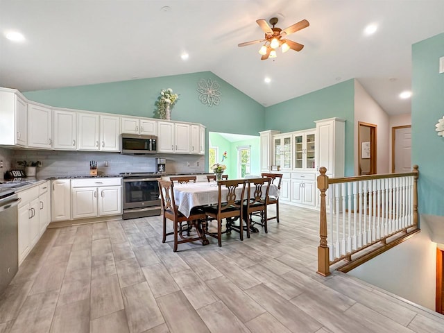 N2242 Keller Rd, Marinette, WI 54143 - kitchen featuring stainless steel appliances, high vaulted ceiling, a ceiling fan, white cabinetry, and recessed lighting