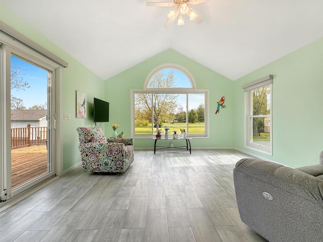 N2242 Keller Rd, Marinette, WI 54143 - living area featuring a ceiling fan, wood finished floors, vaulted ceiling, and baseboards