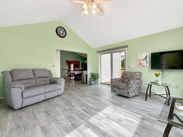 N2242 Keller Rd, Marinette, WI 54143 - living area with ceiling fan, high vaulted ceiling, baseboards, and light wood-style flooring