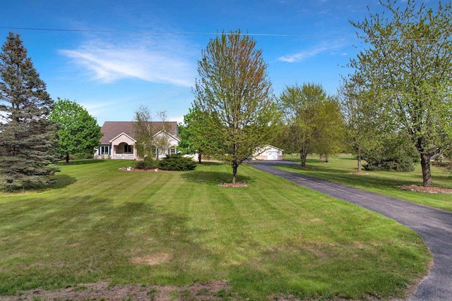 N2242 Keller Rd, Marinette, WI 54143 - view of front facade with a front yard and a detached garage