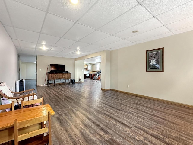 N2242 Keller Rd, Marinette, WI 54143 - living area with a drop ceiling, dark wood finished floors, and baseboards