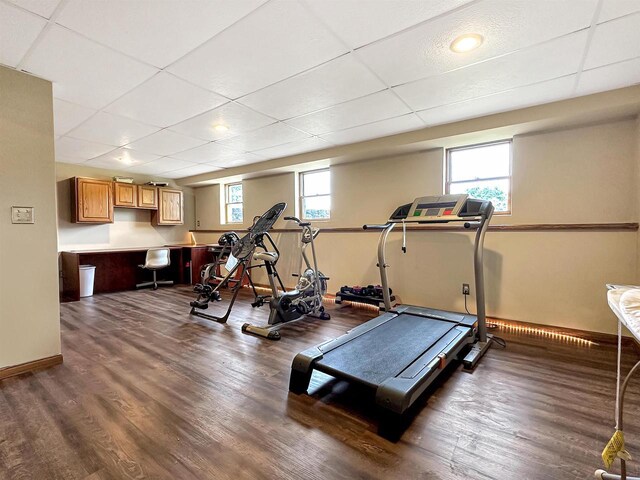 N2242 Keller Rd, Marinette, WI 54143 - workout area featuring wood finished floors, a paneled ceiling, and baseboards