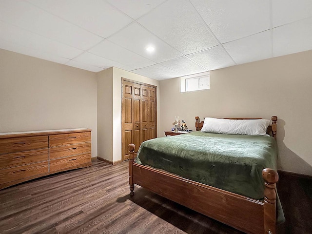 N2242 Keller Rd, Marinette, WI 54143 - bedroom with wood finished floors, a paneled ceiling, a closet, and baseboards