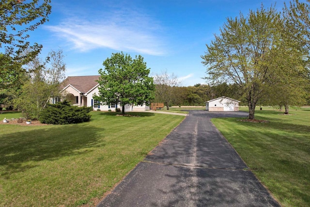 N2242 Keller Rd, Marinette, WI 54143 - obstructed view of property with a front yard and a garage