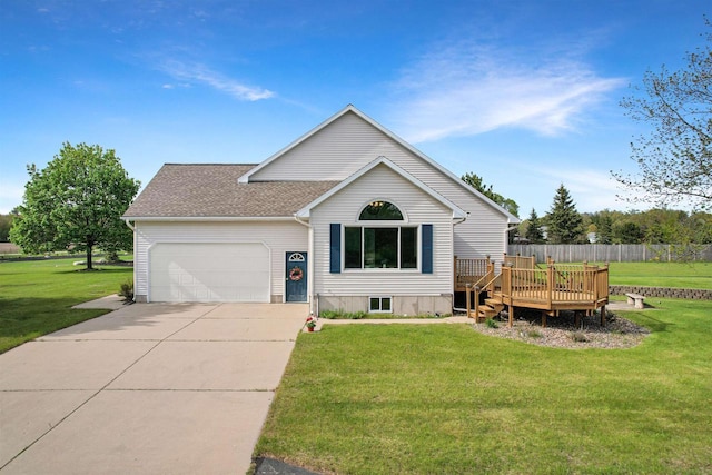 N2242 Keller Rd, Marinette, WI 54143 - view of front of home featuring an attached garage, a wooden deck, a front yard, concrete driveway, and a shingled roof