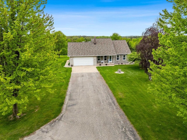 N3270 State Rd 76, Hortonville, WI 54944 - view of front facade featuring an attached garage, asphalt driveway, a front yard, and a chimney