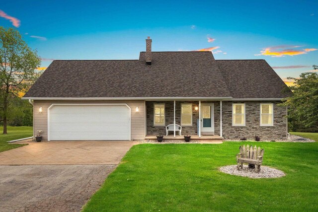 N3270 State Rd 76, Hortonville, WI 54944 - view of front of home featuring a porch, a chimney, a garage, a front yard, and driveway