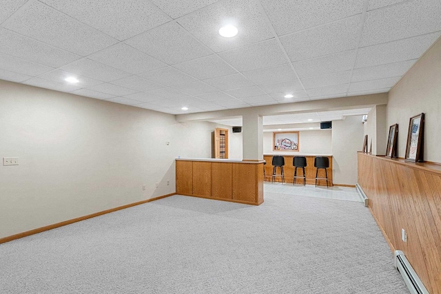 N3270 State Rd 76, Hortonville, WI 54944 - basement featuring a baseboard heating unit, carpet flooring, bar area, a drop ceiling, and baseboards