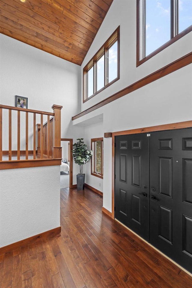 4230 Dalby Rd, Black Earth, WI 53515 - foyer entrance featuring baseboards, high vaulted ceiling, hardwood / wood-style flooring, and wooden ceiling