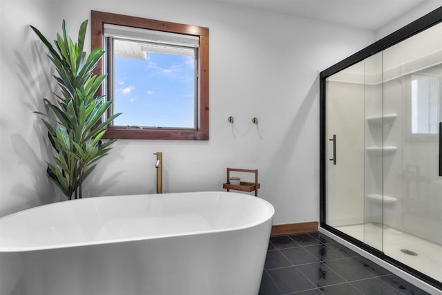 4230 Dalby Rd, Black Earth, WI 53515 - full bathroom with a stall shower, tile patterned flooring, baseboards, and a freestanding tub
