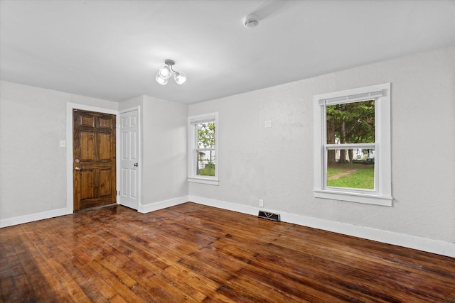 5015 N 25th St, Milwaukee, WI 53209 - empty room featuring baseboards and dark wood finished floors