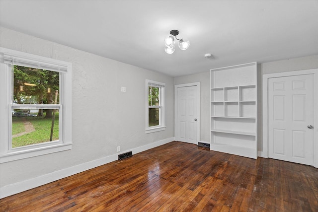 5015 N 25th St, Milwaukee, WI 53209 - unfurnished bedroom with baseboards and hardwood / wood-style floors
