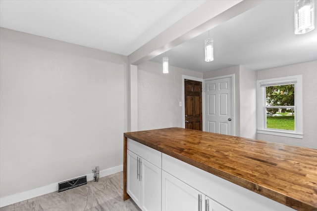 5015 N 25th St, Milwaukee, WI 53209 - laundry room featuring light marble finish flooring and baseboards
