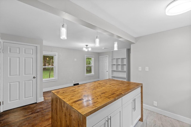 5015 N 25th St, Milwaukee, WI 53209 - kitchen featuring butcher block countertops, dark wood-style flooring, and baseboards