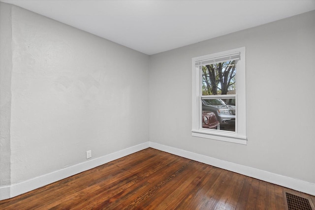5015 N 25th St, Milwaukee, WI 53209 - unfurnished room with baseboards and dark wood finished floors