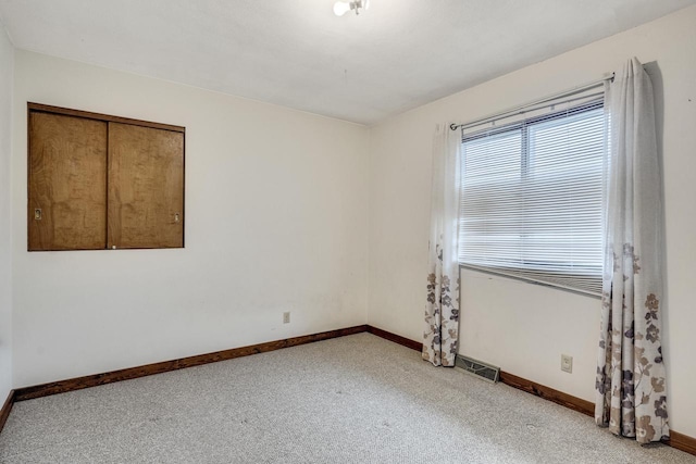 2530 Onalaska Ave, La Crosse, WI 54603 - carpeted empty room featuring baseboards