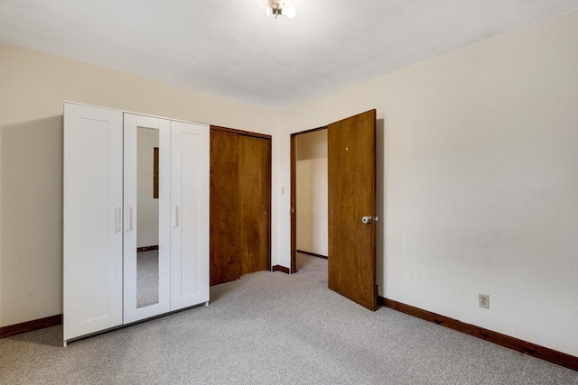 2530 Onalaska Ave, La Crosse, WI 54603 - unfurnished bedroom featuring carpet, baseboards, and a closet
