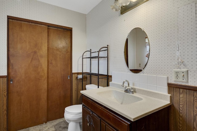 2530 Onalaska Ave, La Crosse, WI 54603 - bathroom with wallpapered walls, toilet, and vanity