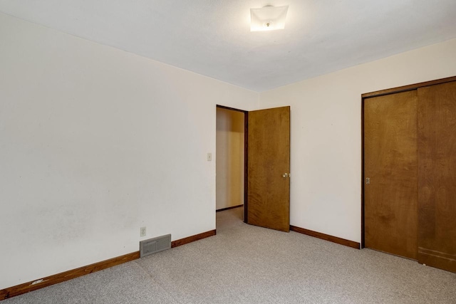 2530 Onalaska Ave, La Crosse, WI 54603 - unfurnished bedroom featuring carpet flooring, baseboards, and a closet