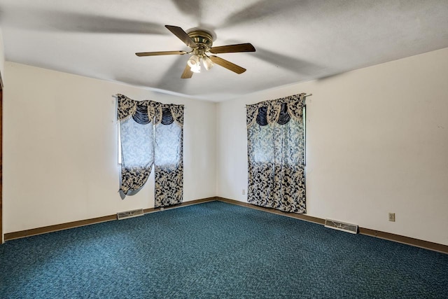 2530 Onalaska Ave, La Crosse, WI 54603 - unfurnished room with a ceiling fan, dark colored carpet, and baseboards