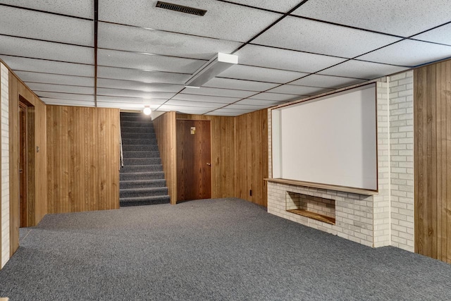 2530 Onalaska Ave, La Crosse, WI 54603 - finished basement with carpet flooring, wooden walls, stairway, and a paneled ceiling