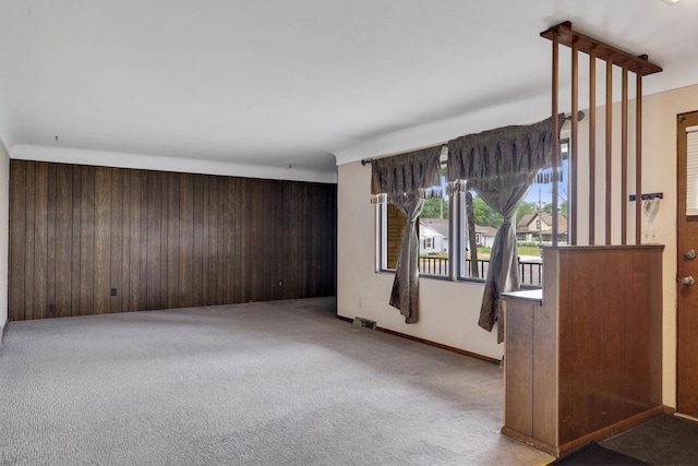 2530 Onalaska Ave, La Crosse, WI 54603 - unfurnished room featuring carpet and wooden walls