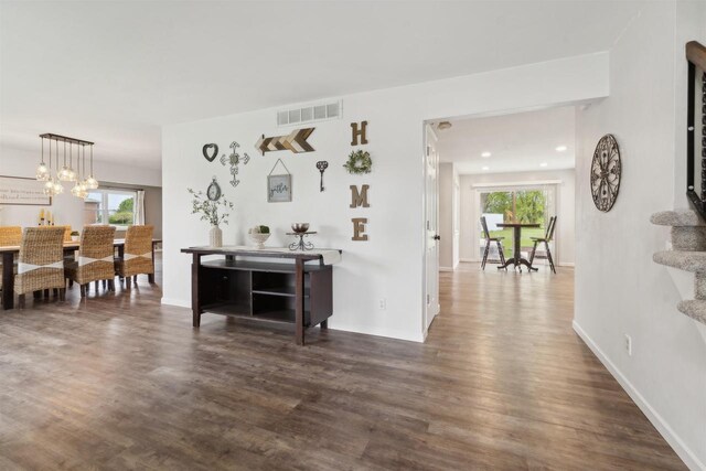1089 Audrey Ct, North Fond Du Lac, WI 54937 - living room with plenty of natural light, dark wood-style floors, and stairway