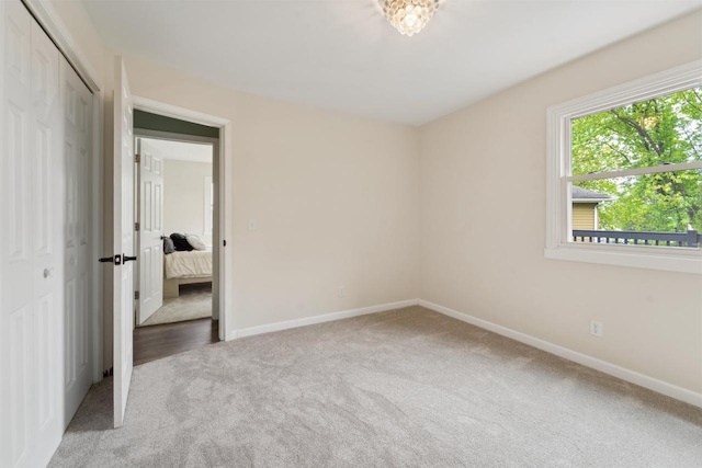 1089 Audrey Ct, North Fond Du Lac, WI 54937 - unfurnished bedroom with carpet floors, baseboards, and a closet