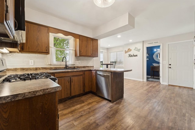 1089 Audrey Ct, North Fond Du Lac, WI 54937 - kitchen with a sink, dishwasher, dark wood finished floors, decorative backsplash, and recessed lighting
