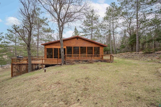 15075 S Lost Lake Rd, Wascott, WI 54838 - back of property featuring a sunroom, a lawn, and a deck