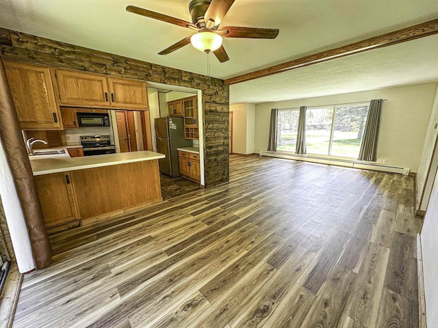 1200 4th Ave N, Park Falls, WI 54552 - kitchen featuring freestanding refrigerator, stainless steel electric range, brown cabinets, and baseboard heating