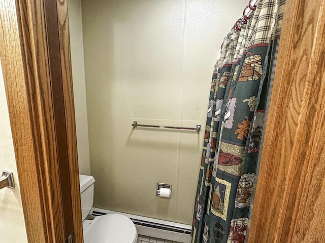 1200 4th Ave N, Park Falls, WI 54552 - full bathroom with a baseboard heating unit, toilet, tile patterned floors, and a shower with shower curtain
